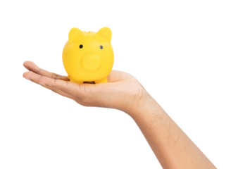 Hand holding yellow piggy bank for saving money on white background