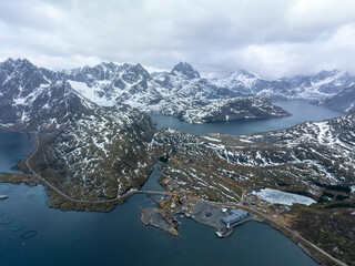 Dramatic Drone View of Snowy Mountains and Fjords in Lofoten, Norway – Isolated Fishing Outpost,...