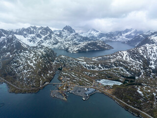 Dramatic Drone View of Snowy Mountains and Fjords in Lofoten, Norway – Isolated Fishing Outpost,...