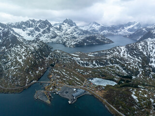 Dramatic Drone View of Snowy Mountains and Fjords in Lofoten, Norway – Isolated Fishing Outpost,...