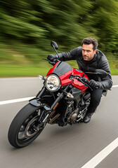 Obraz premium A man is riding a motorcycle with a helmet on. The man is wearing a leather jacket and is leaning forward. The motorcycle is red and black