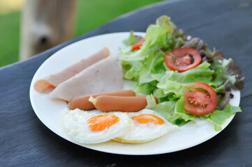 egg , sausage and ham with vegetable or sunny side up egg