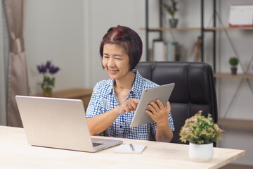 Seniors  woman is learning to upskill  AI technology.