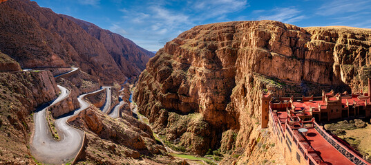 Cliffside terraced hotel, desert landscape.