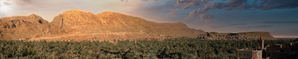 Oasis village nestled in a desert mountain.
