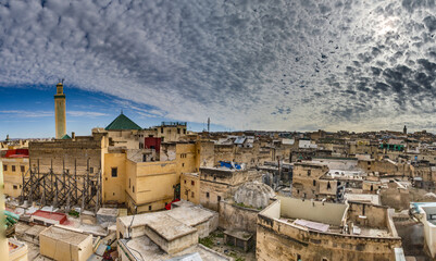 Moroccan city rooftops, mosques, and construction.