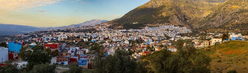 Hillside town with colorful buildings.