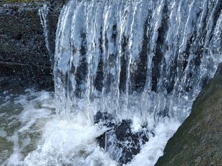 the river water is fast flowing, fresh and clear	