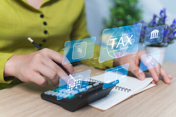 Tax planning concept, Money to be withheld to the government, Businesswoman enters data in...