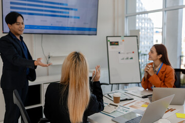 group of businessman are brainstorming about their business project, these entrepreneurs are meeting about finance, accounting and marketing in the office, presentation, discussing