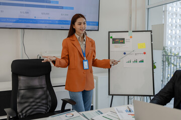 one of marketing team is explaining the presentation to the team, group of businessman are meeting...