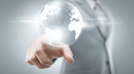 A person pointing at a digital globe, symbolizing global connectivity and innovation.