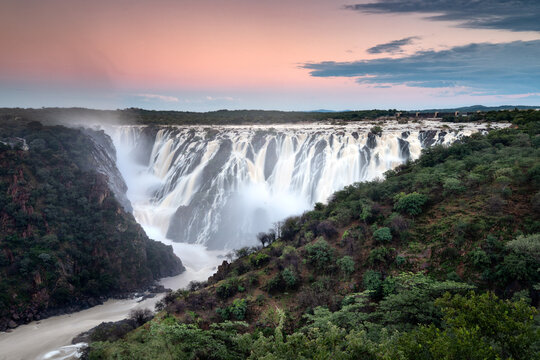 Ruacana Falls under a pastel Sky.