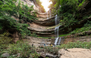 Blurred people travel at TadYai waterfall of Petchaboon, Thailand. local travel destination for tourism.