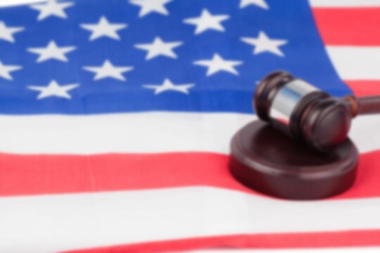 Naklejki Close-up of gavel on flag