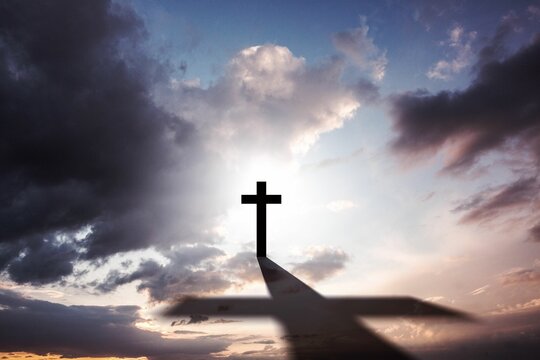 Fototapeta Flat design featuring cross silhouette casting long shadow over platform under cloudy gradient sky