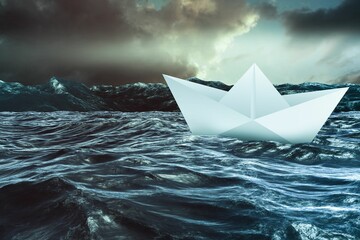 Paper boat floating on the sea