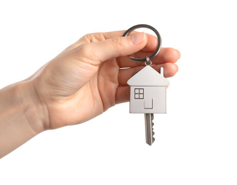 Hand holding house key with keychain in home shape. Transparent background - Powered by Adobe