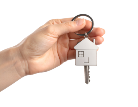 Hand holding house key with keychain in home shape. Transparent background