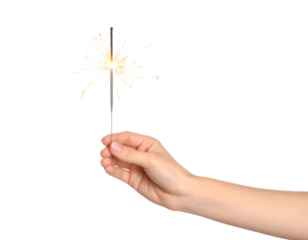 Hand holding sparkler emitting bright sparks