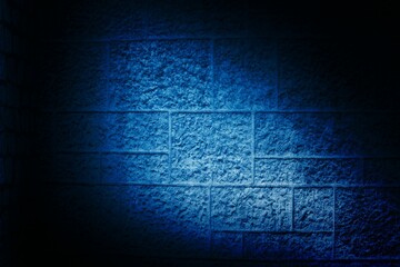 Concrete block wall is being shown in flat design, with blue spotlight beam exposing rough surface