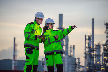 Petroleum engineers are working at petroleum refineries.