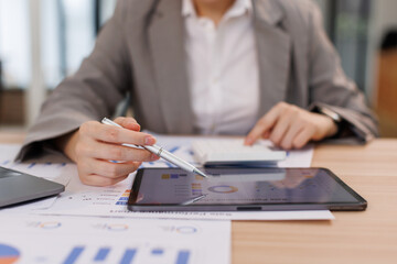 Asian businesswoman Accounting using calculating income-expenditure and analyzing real estate...