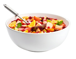 Fresh fruit salad in a large bowl with a serving spoon