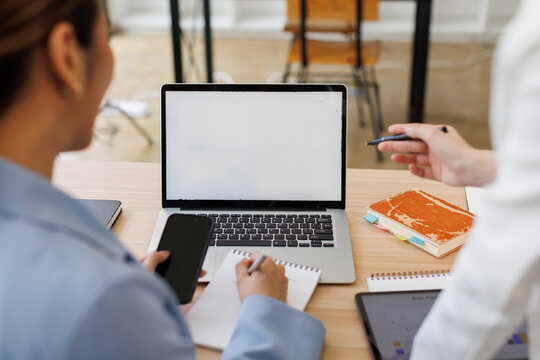 Team of confident business people point to graphs and charts to analyze market data, investor working start up project for strategy plan with document.
