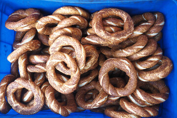 Freshly baked turkish simit in a blue container