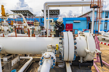 Male worker inspection and measurement thickness pipeline oil and gas at check record