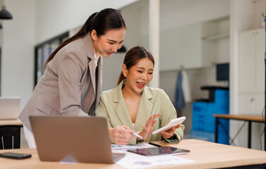 Team of business partnership use calculator to calculate coworkers analysis strategy with...