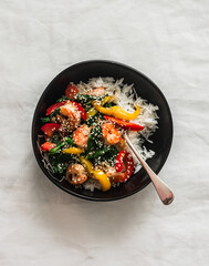 Basmati rice and vegetables, shrimp, spinach stir fry - delicious asian style lunch on a light...