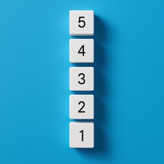 White number tiles counting down on a blue background