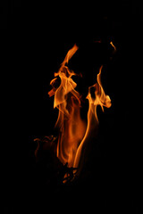 Fire flames on black background. Closeup of fire flames isolated on black background