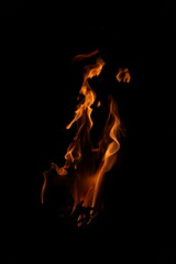 Fire flames on black background. Closeup of fire flames isolated on black background
