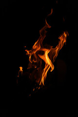 Fire flames on black background. Closeup of fire flames isolated on black background
