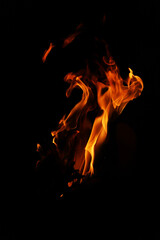 Fire flames on black background. Closeup of fire flames isolated on black background