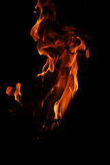 Fire flames on black background. Closeup of fire flames isolated on black background
