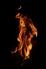 Fire flames on black background. Closeup of fire flames isolated on black background