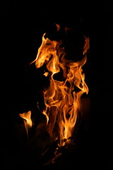 Fire flames on black background. Closeup of fire flames isolated on black background