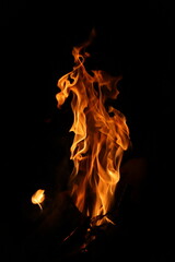 Fire flames on black background. Closeup of fire flames isolated on black background