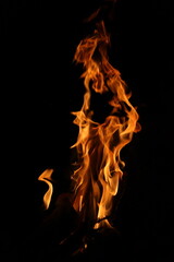 Fire flames on black background. Closeup of fire flames isolated on black background