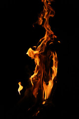 Fire flames on black background. Closeup of fire flames isolated on black background