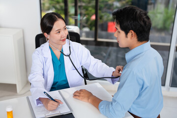 Asian doctor talk with patient about disease symptom, doctor use stethoscope listening lung of...