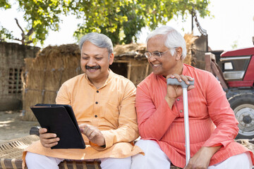 Senior man using digital laplet atvillage.