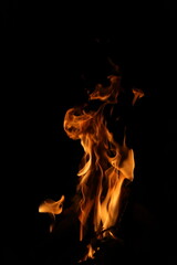 Fire flames on black background. Closeup of fire flames isolated on black background