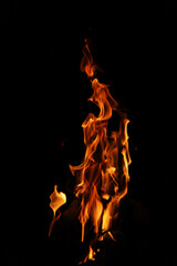 Fire flames on black background. Closeup of fire flames isolated on black background