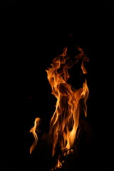 Fire flames on black background. Closeup of fire flames isolated on black background
