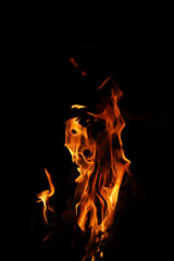 Fire flames on black background. Closeup of fire flames isolated on black background